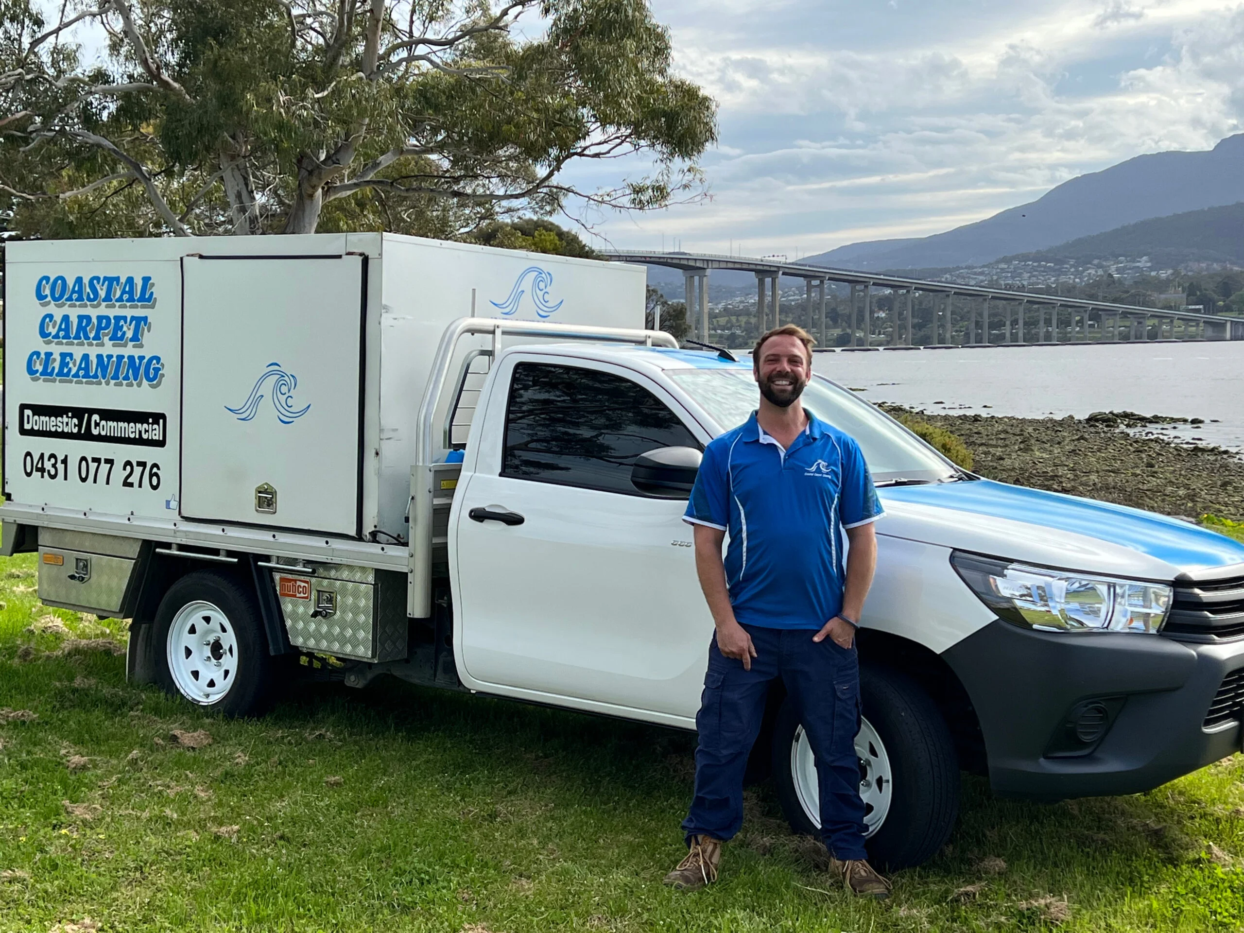 Simon standing in front of Carpet Cleaning vehicle in Hobart